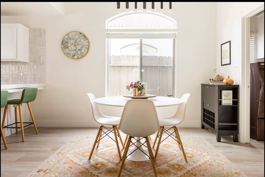Microwave is built into black wine bar on the right of the dining table pictured here.