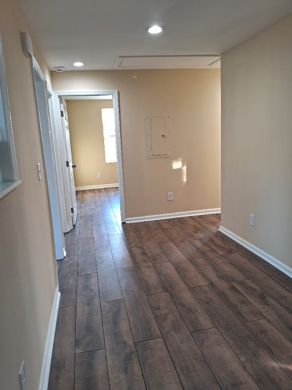 Open central house space from living room, between front bedrooms 1 & 2, and dining room-kitchen.