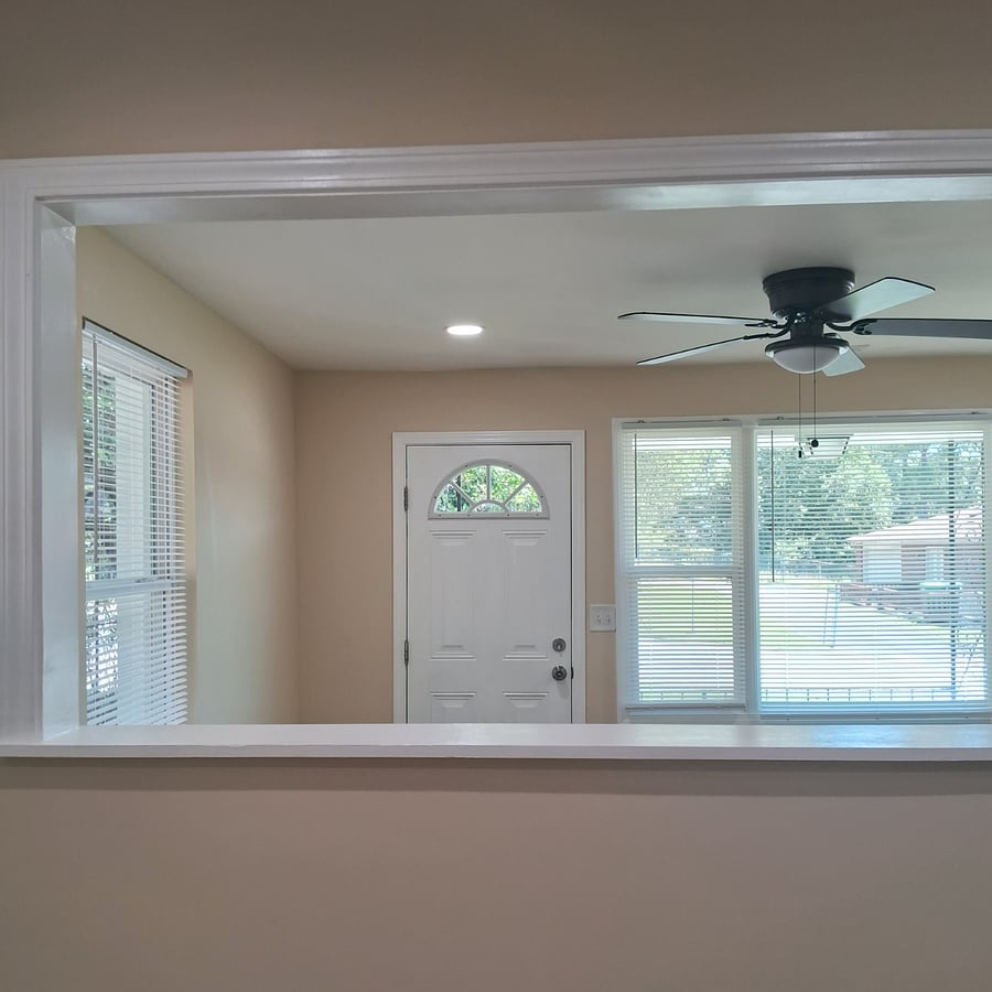 Framed wall opening. View from dining area to living room.