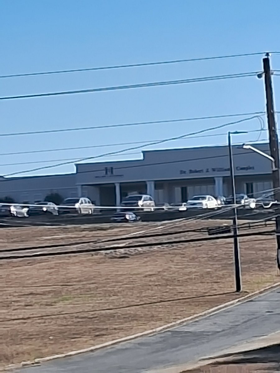 Community college campus diagonally across Anthony Street, visible from front porch.