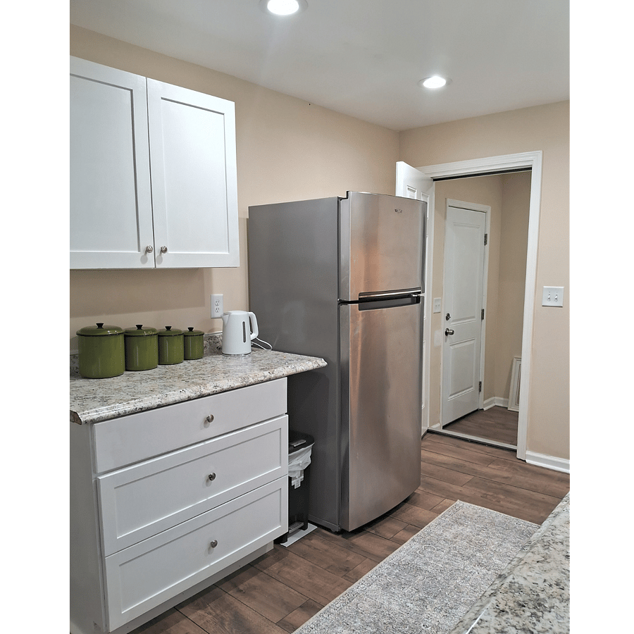 More kitchen cabinets above and drawers below.