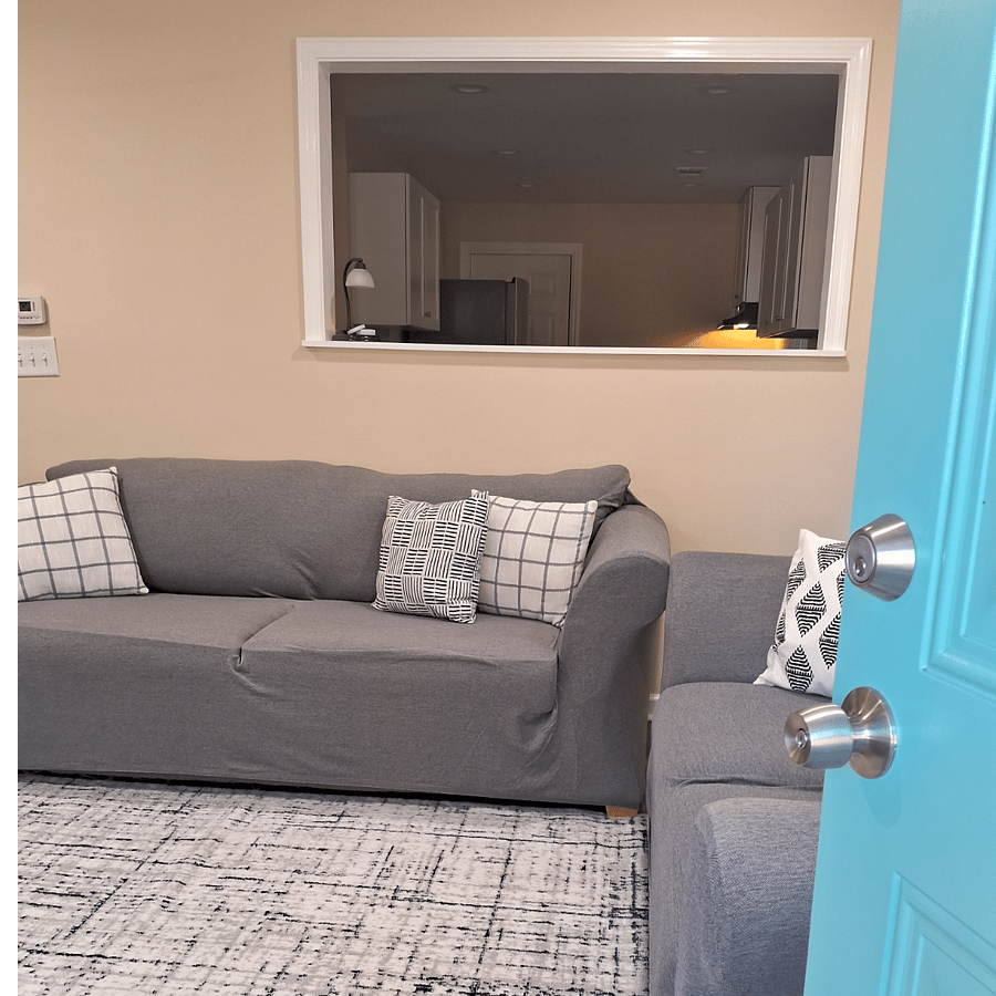 Framed wall opening. View from living room into dining area and kitchen.