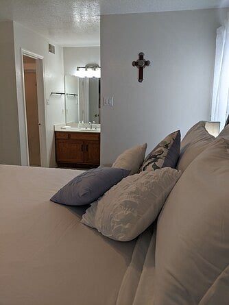 Main floor bedroom with dressing area.