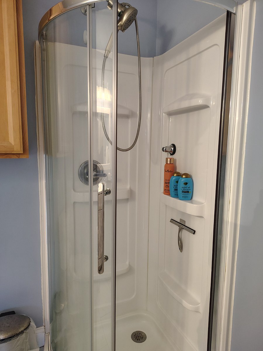shower has wand with two places to mount it