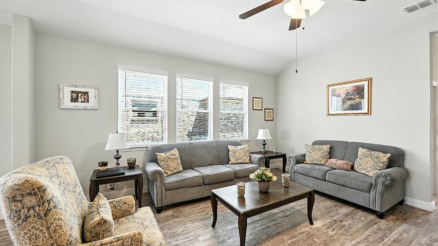 Comfortable living room with plenty of seating, perfect for relaxing evenings, movie nights, or visiting with friends.