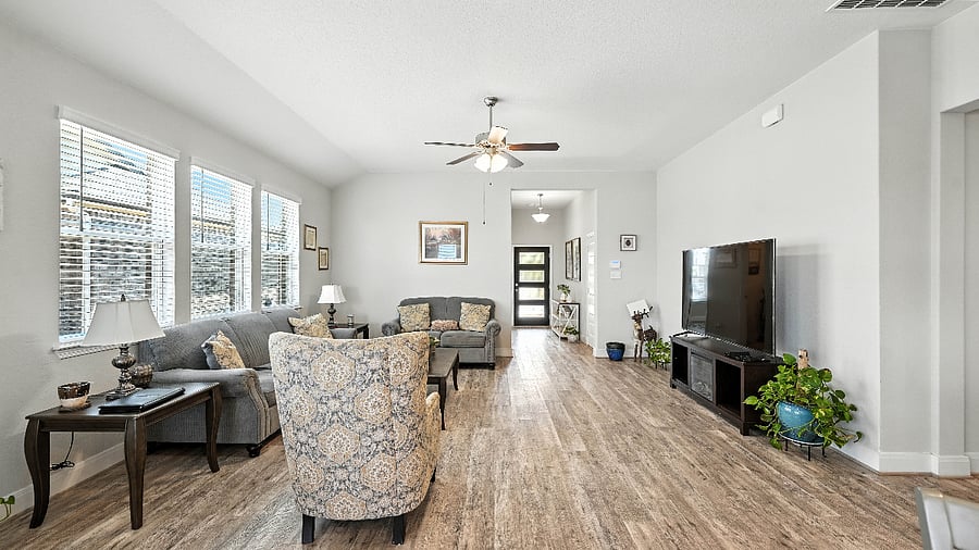 Bright, open living room with comfy seating and room to spread outgreat for movie nights or lazy mornings.