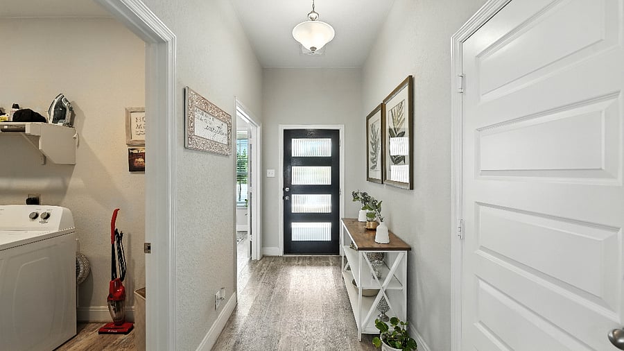 Welcoming entry hallway with clean lines and a warm, homey feel the moment you walk in.