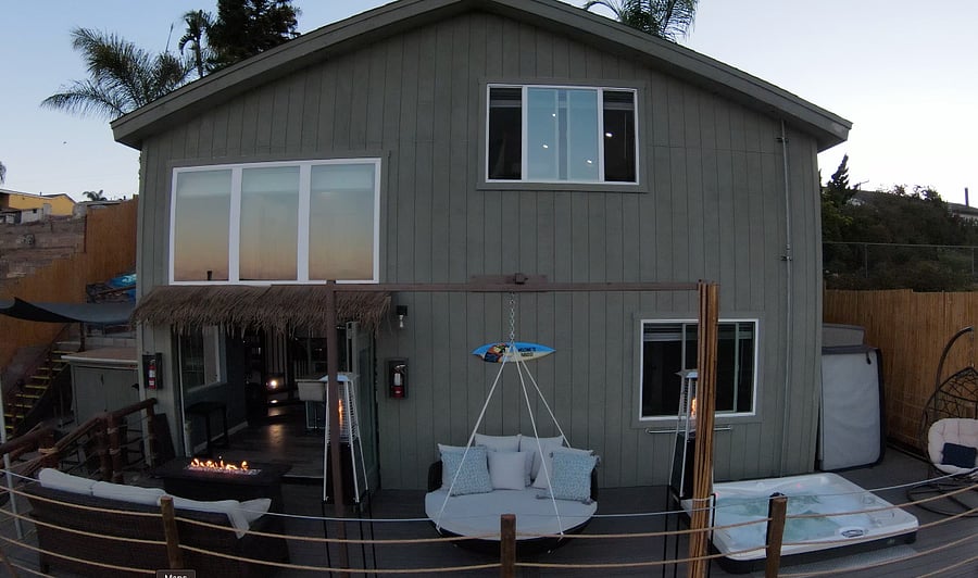 Private patio with jacuzzi, swinging day bed and fire pit