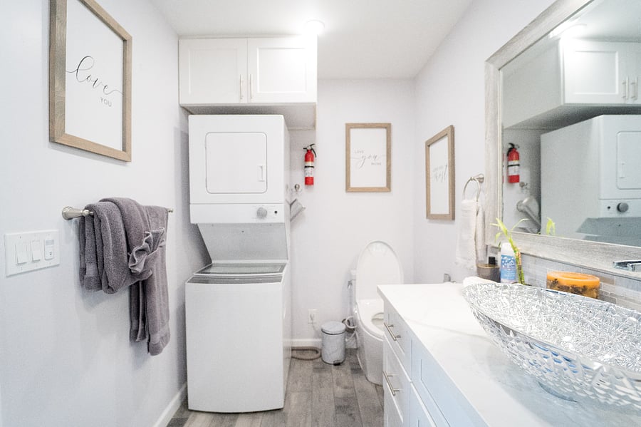 Bathroom with toto toilet, washer/dryer stunning crystal sink and shower