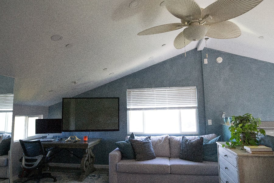 Master bedroom with desk and couch