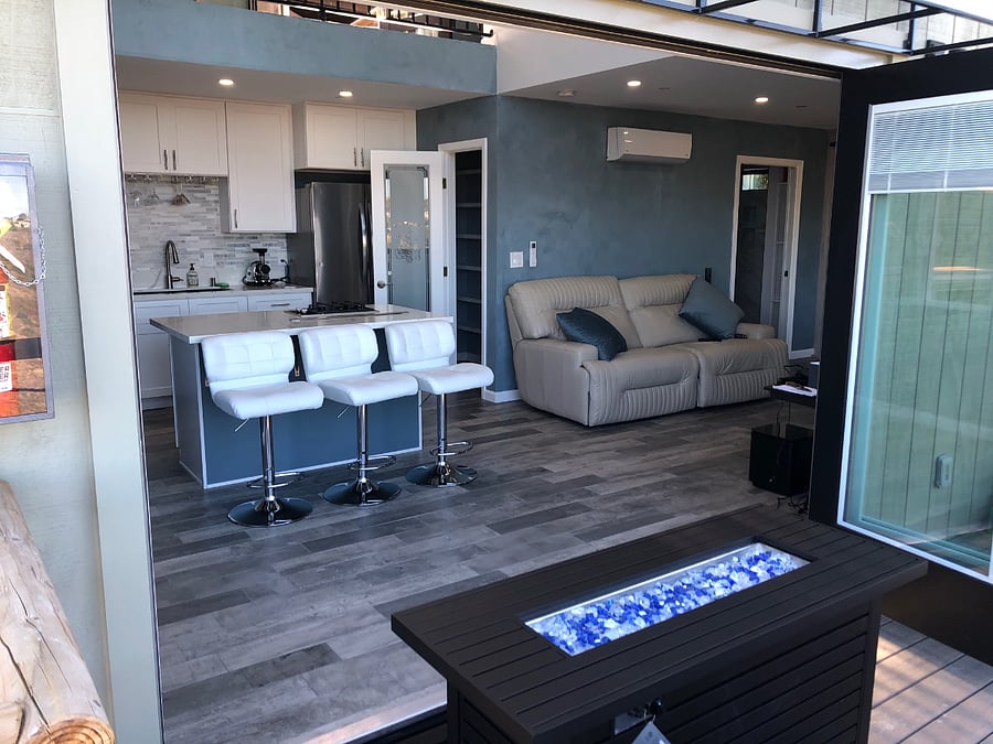 Looking in through the triple bi-fold door into the living room