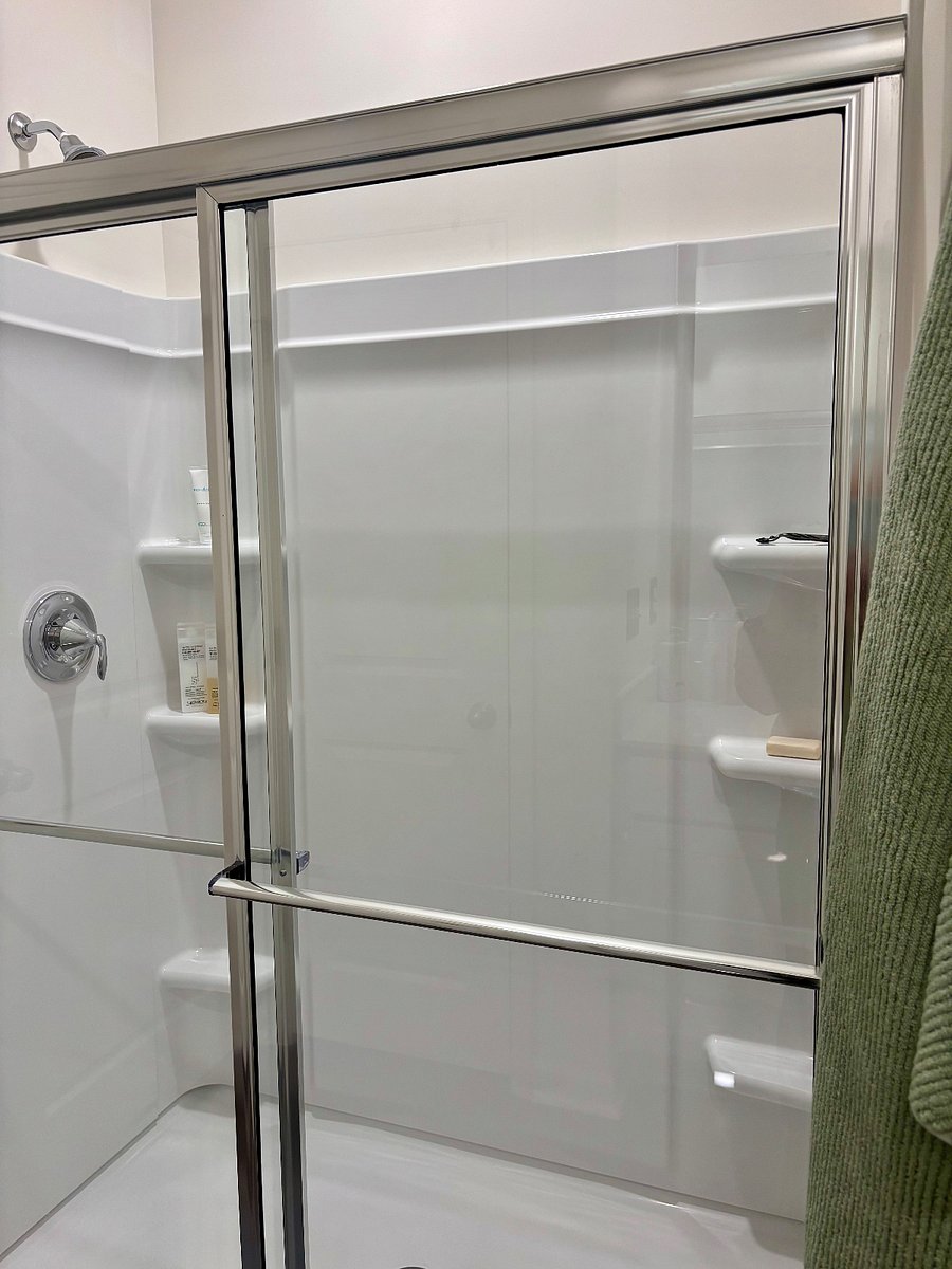 Primary bathroom with full size shower.