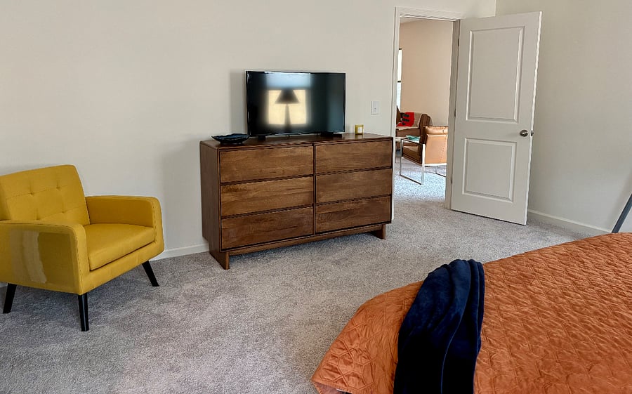 Primary Bedroom with 42" Smart TV. Dresser drawers are empty for your use.