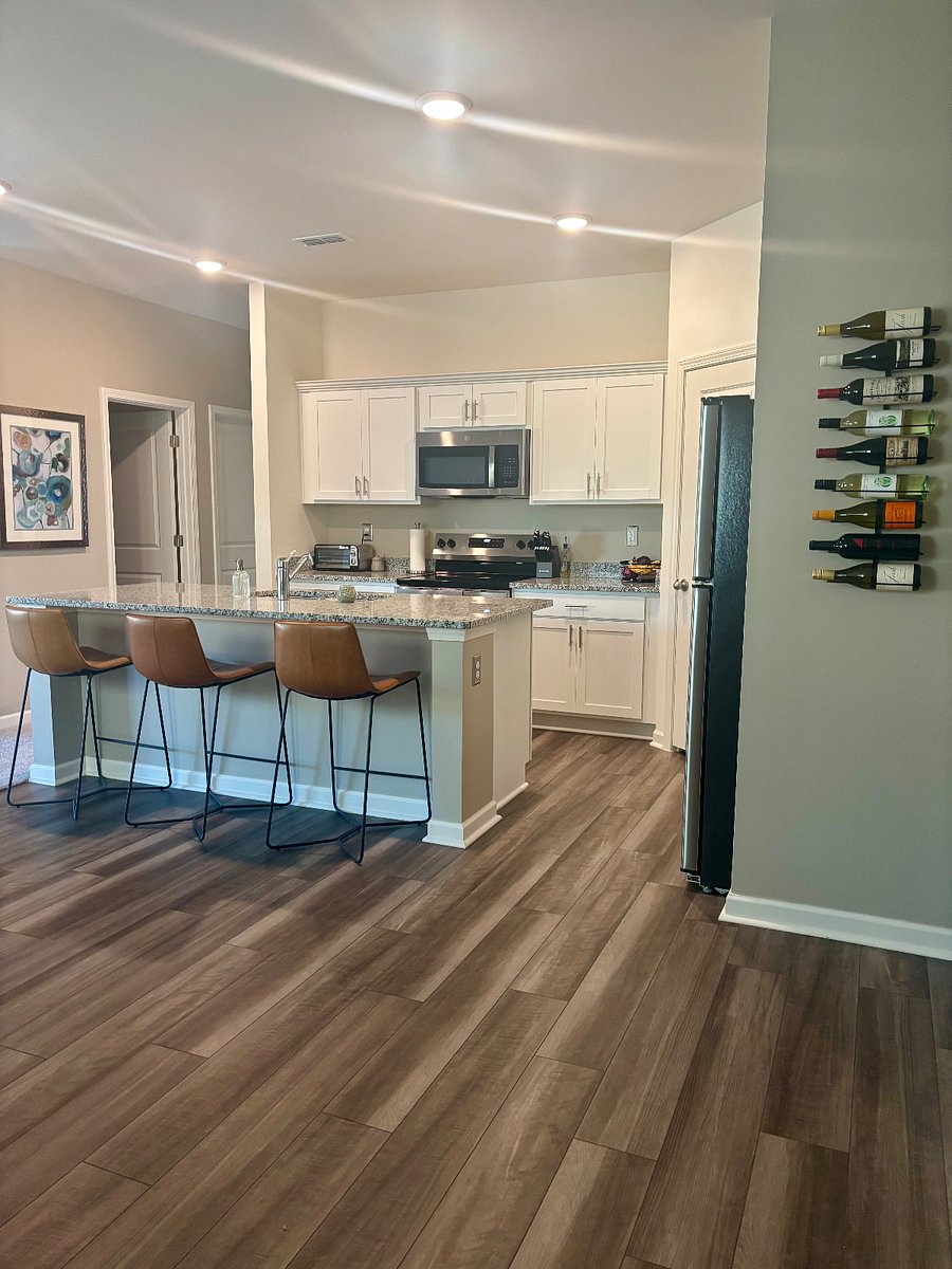 Full Kitchen with a electric stove and stainless steel refrigerator. We have a full pantry with a spacious island for extra seating and convienience.