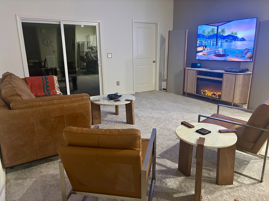 Cozy living area with electric fire place, record player, stereo and 72" Smart TV for your entertainment.
Primary bedroom is adjacent to the living room as well as the outdoor patio.
