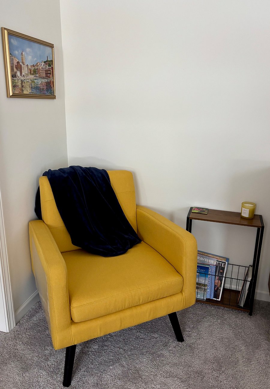 Quaint reading area to relax in the primary bedroom.