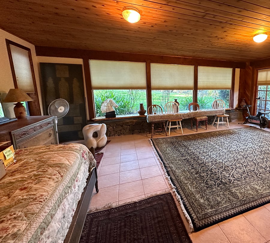 2nd bdrm view looking at garden and large front lawn from plate glass windows