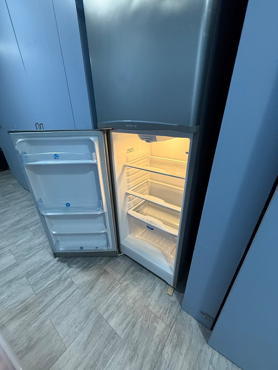 Interior medium sized fridge.