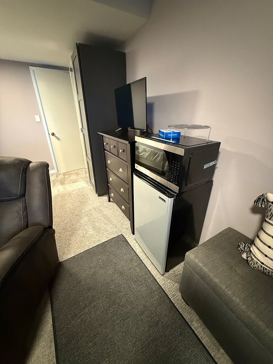 Small fridge and microwave that doubles as an oven.