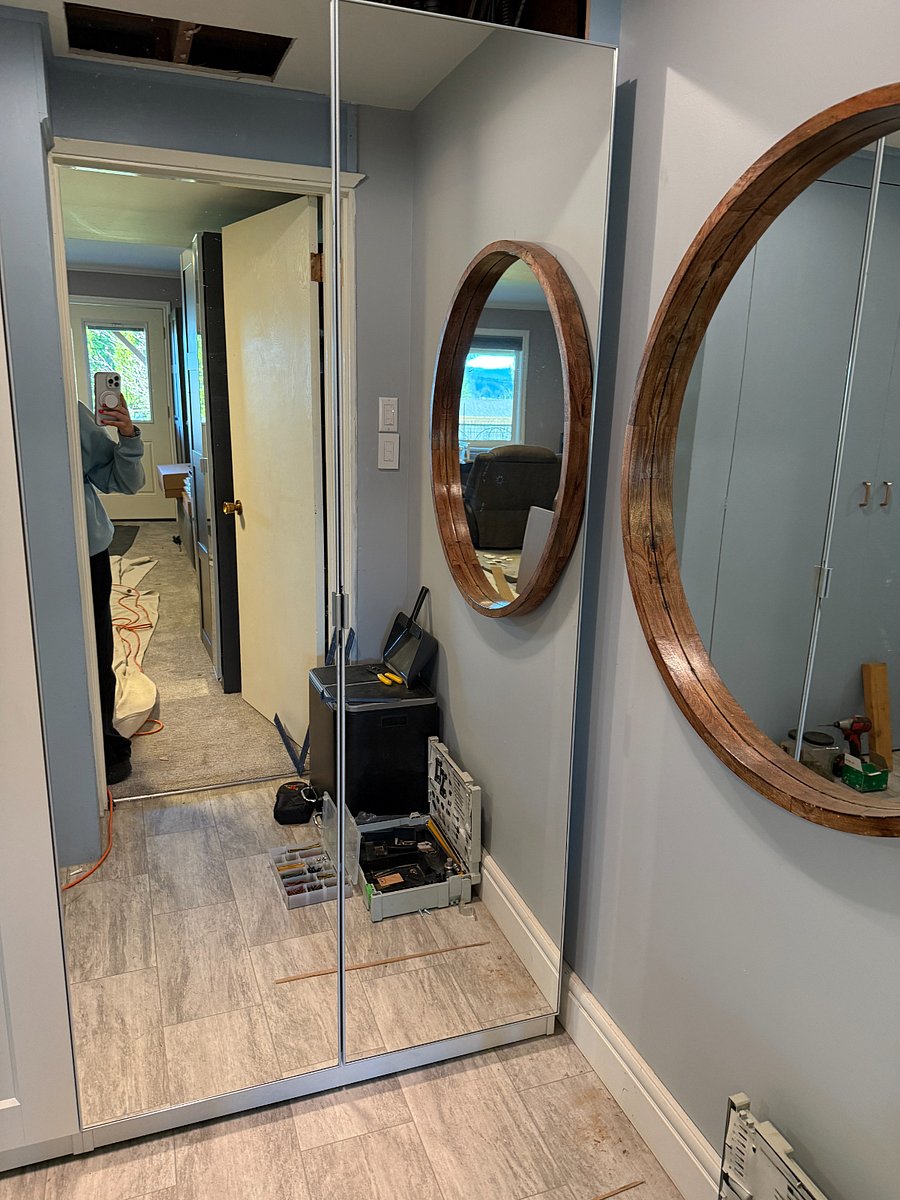 Hallway down to the the bathroom and kitchenette and laundry has a nice mirrored closet.