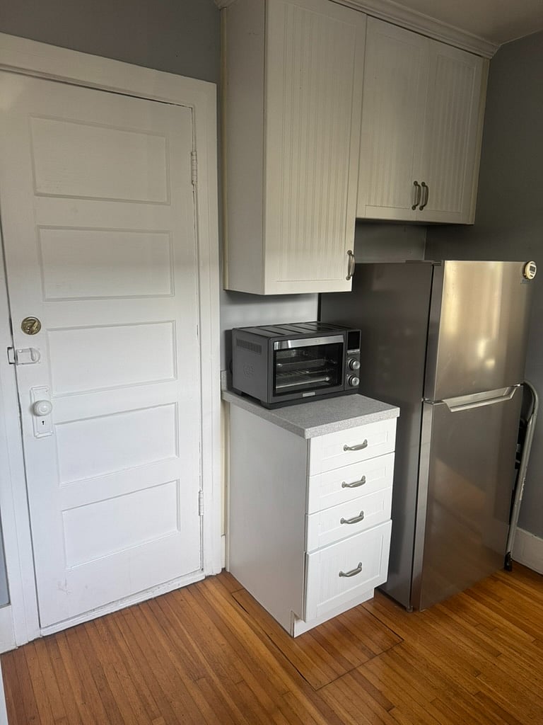right side of the kitchen (back door leading to shared patio area)