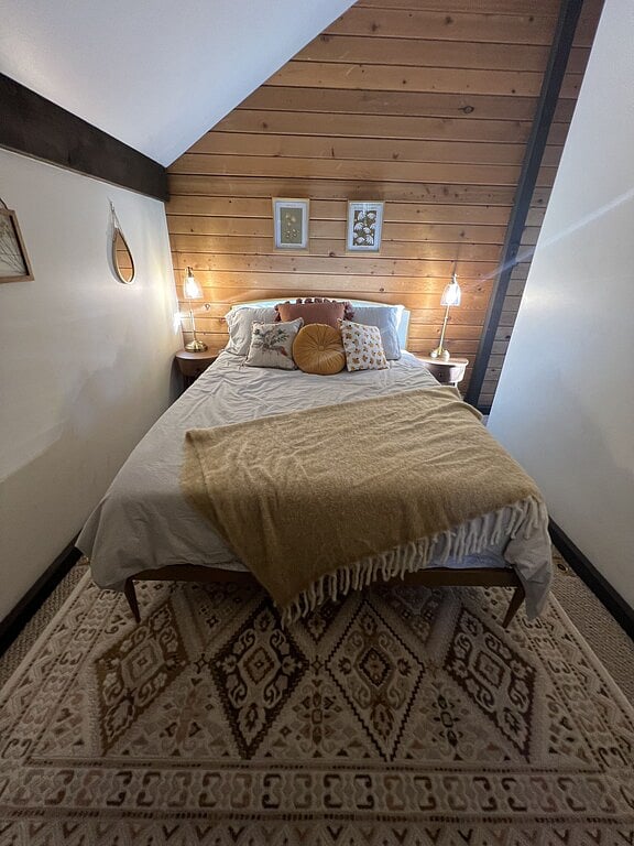 Upstairs bedroom with queen bed and Smart Tv.