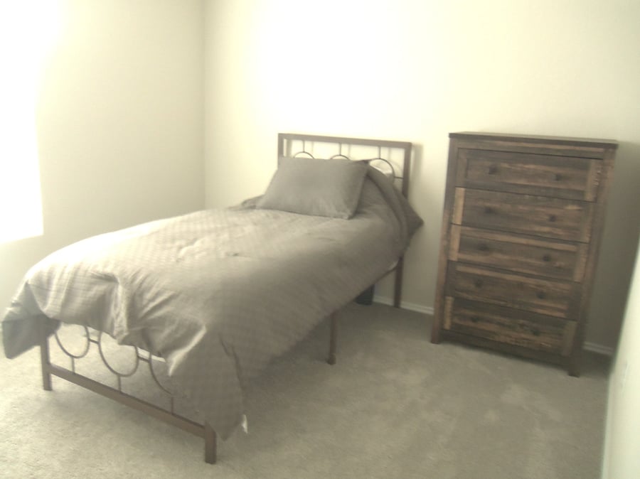 Third bedroom, twin size bed, dresser and closet. 