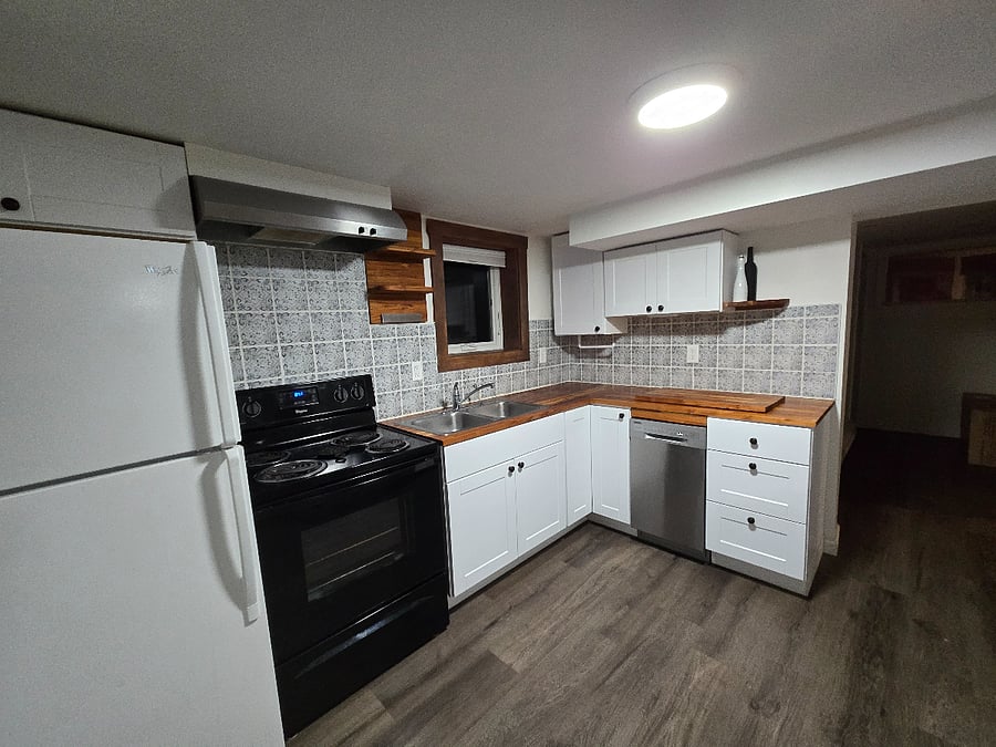 Full kitchen with dishwasher, south facing window, knife storage and cutting boards. Fully stocked with all necessities and more.