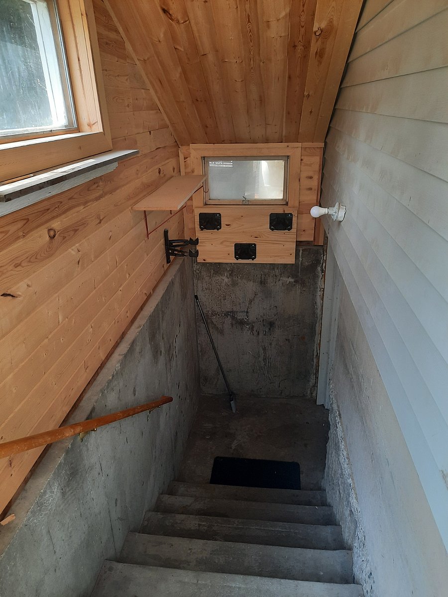 Private and separate entrance to unit that is insulated and has a bike rack and a triple ski rack, lighting and shelving for extra storage.