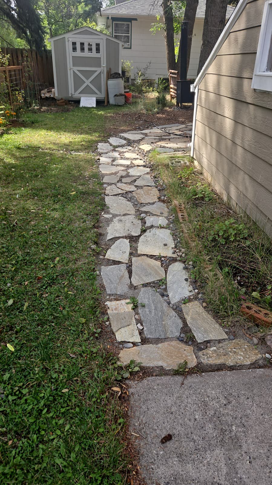 Pathway leads from on-street parking to private entrance with a mailbox designated for tenants only.