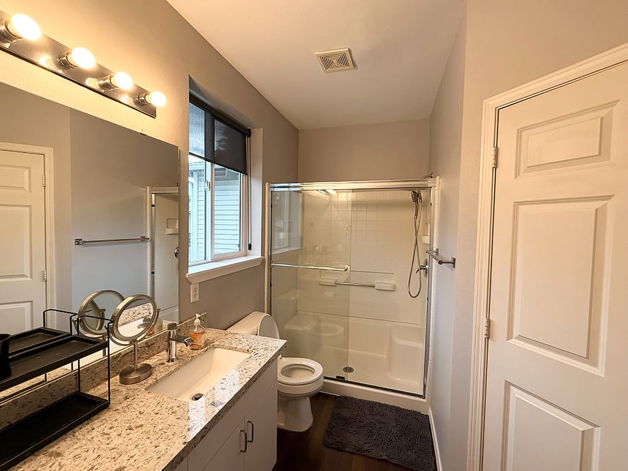 Primary Bathroom includes a double sink, walk-in shower & walk-in closet