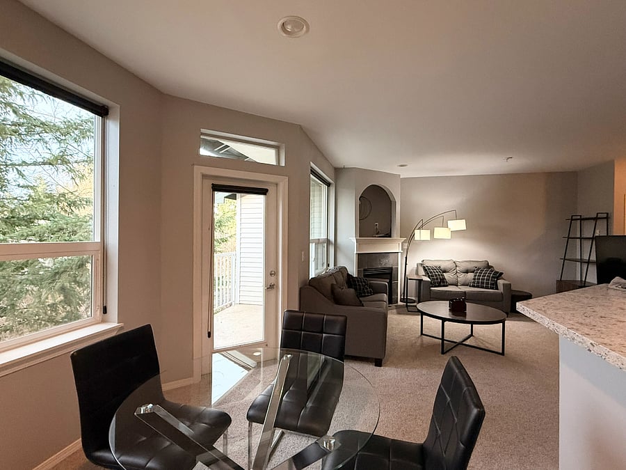 View from the Dining Area peering into the Living Room/Outside with private outdoor views