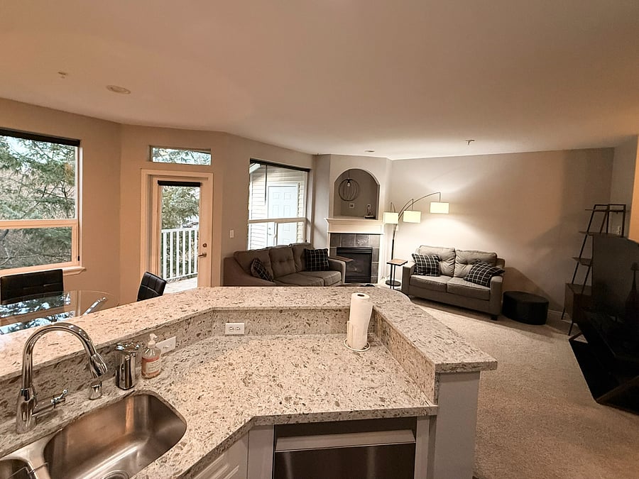 Open Concept Kitchen/Living Room - View from the Kitchen peering into the Living Room/Outside.. Amazing for hosting small gathering & Dinners