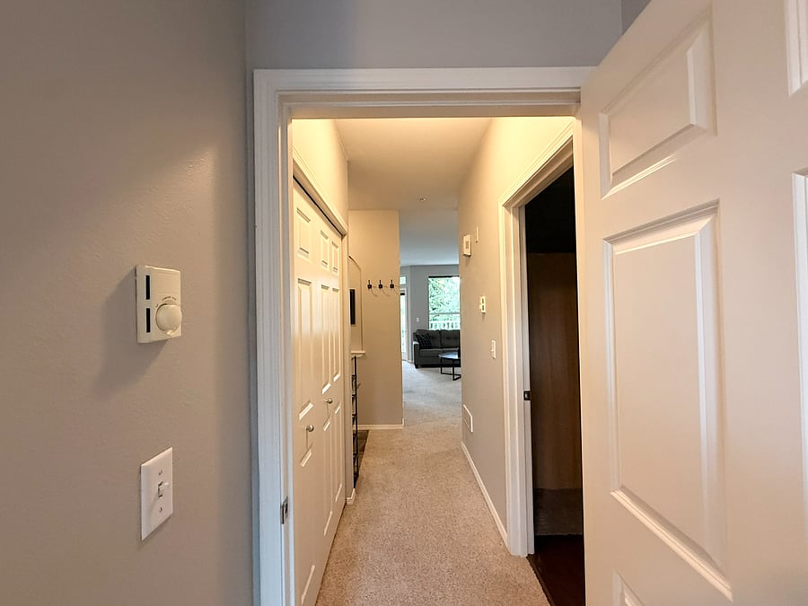 View from the Guest Bedroom Entry - Guest bathroom to the right & In-unit washer & dryer to the left