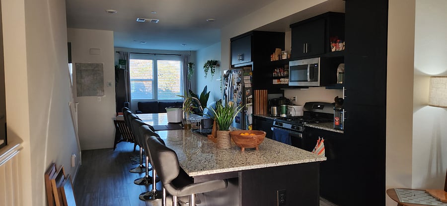 2nd floor kitchen, with granite countertop island.