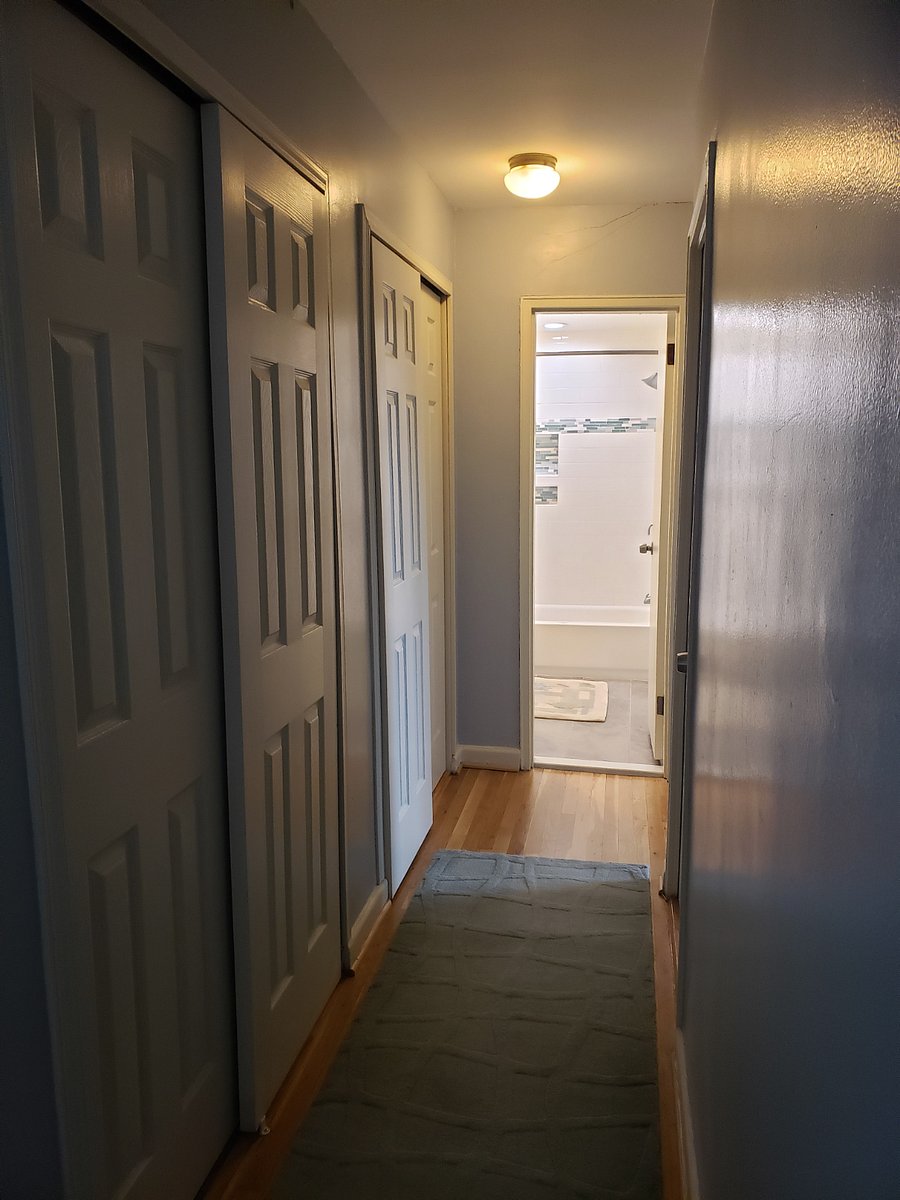Hallway with multiple closets