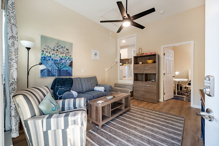 Living room features cubby furniture with lots of storage for your stuff!