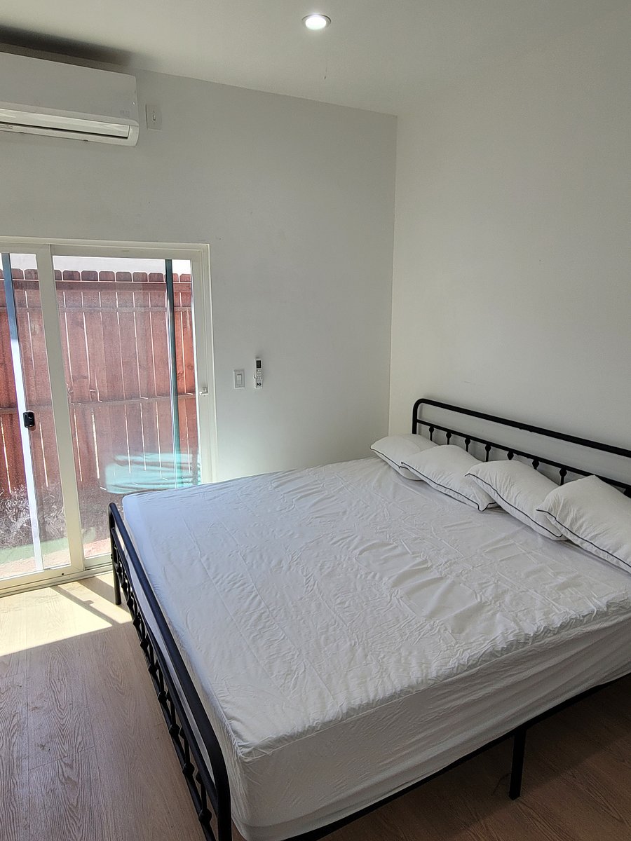 Bedroom with king size bed and office space