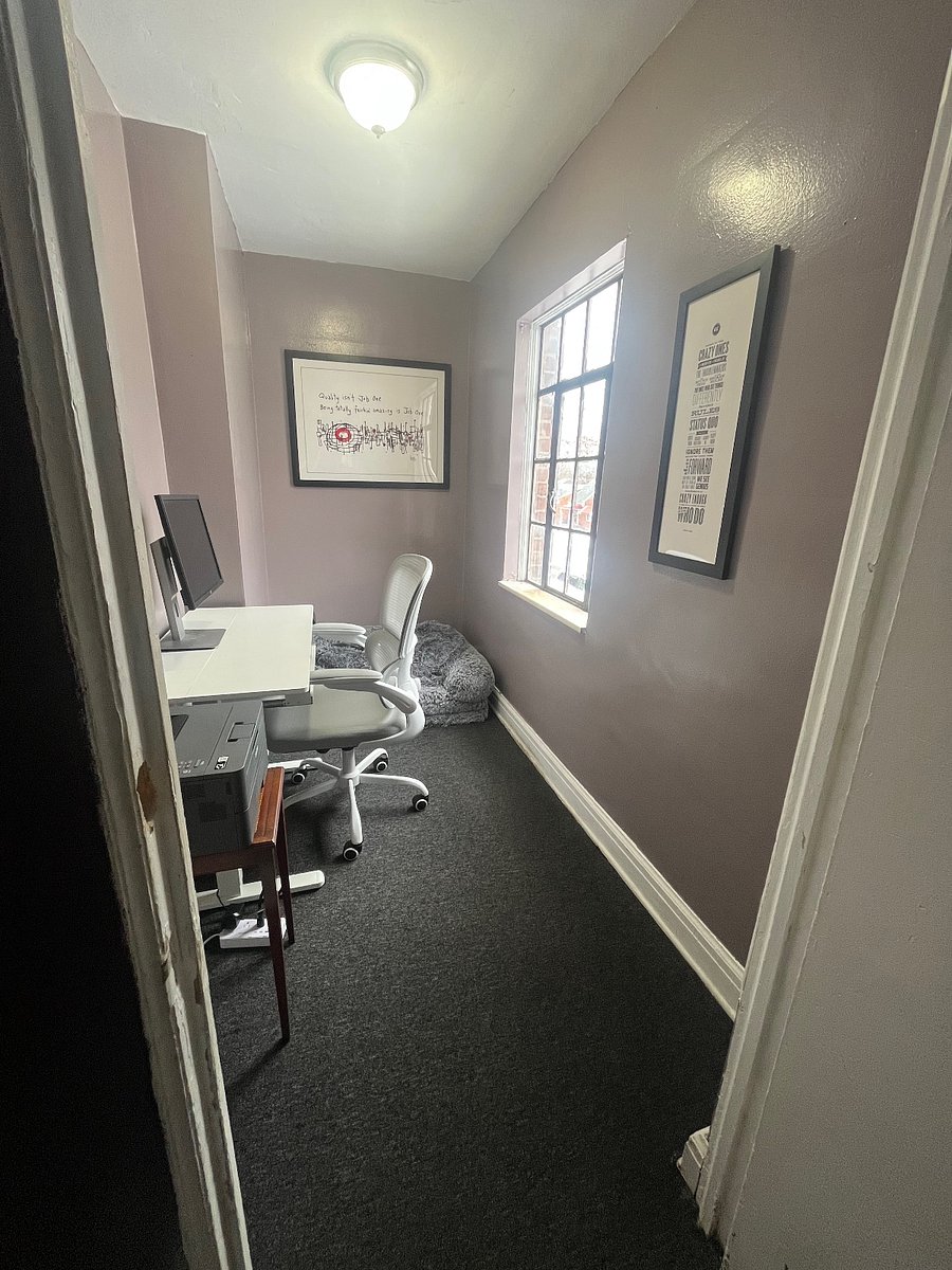 The Snug.  A dedicated workspace with standing desk, office chair and wifi printer. Also a human sized dog bed for resting.