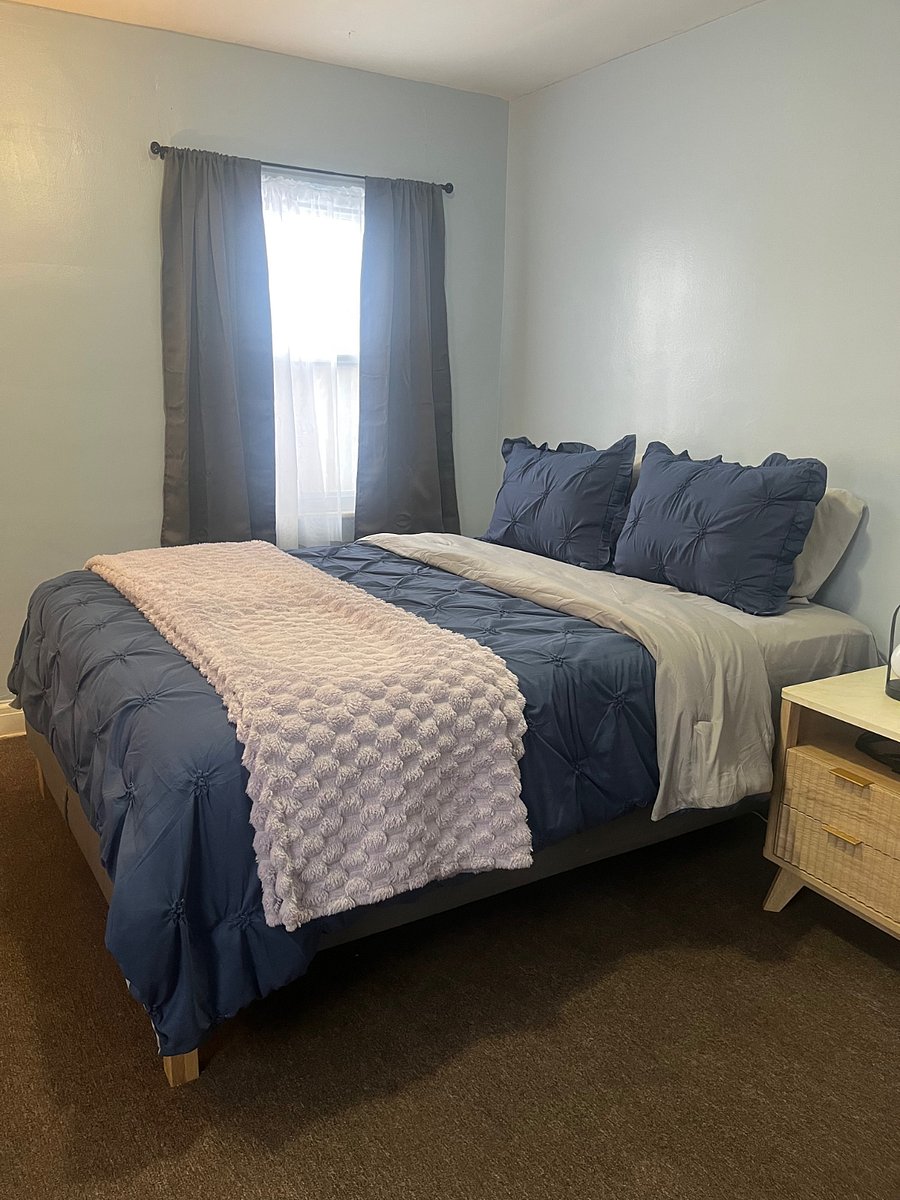 The Blue Bedroom is the master. It contains a desk, chair, queen bed, dresser, nightstands and lamps.
