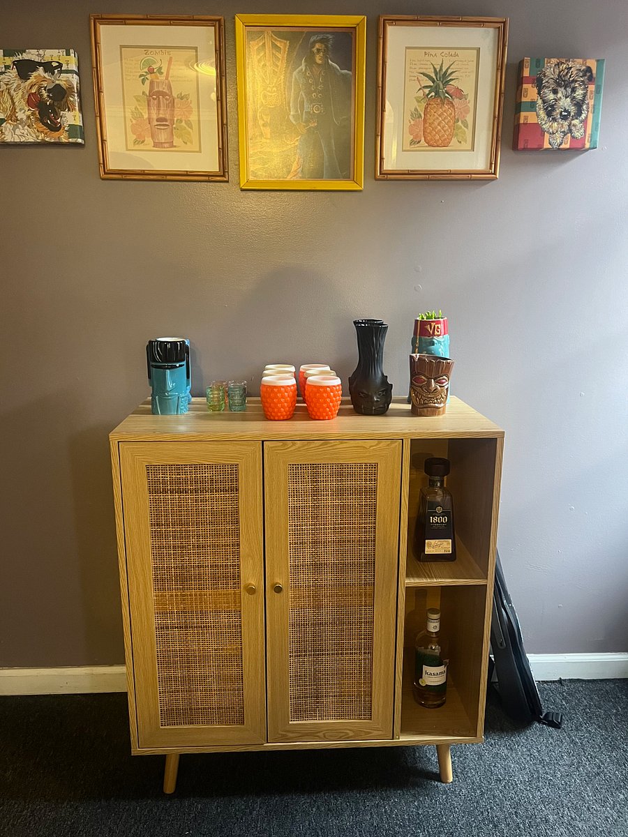 The entryway to the Loft contains a sitting area, with hooks to hang coats.  Also includes this tiny tiki bar.