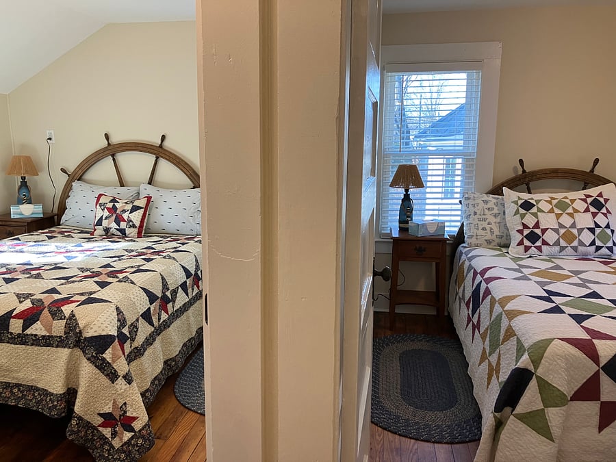 View of both bedrooms: queen bed & full bed. Both have closets.