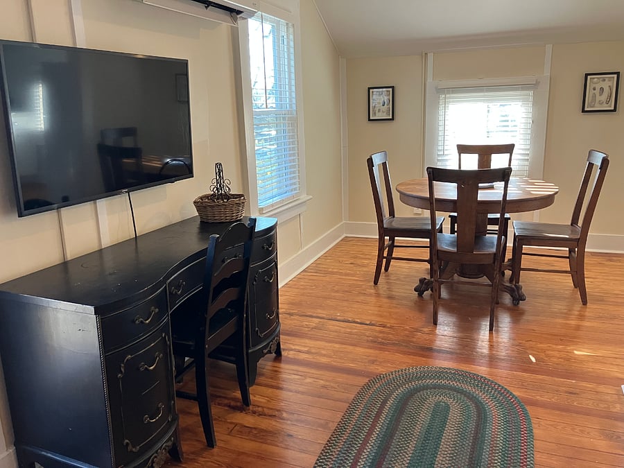 View from couch/living room area: Dedicated workspace & dining room off of the kitchen. Smart TV (no cable/channels).