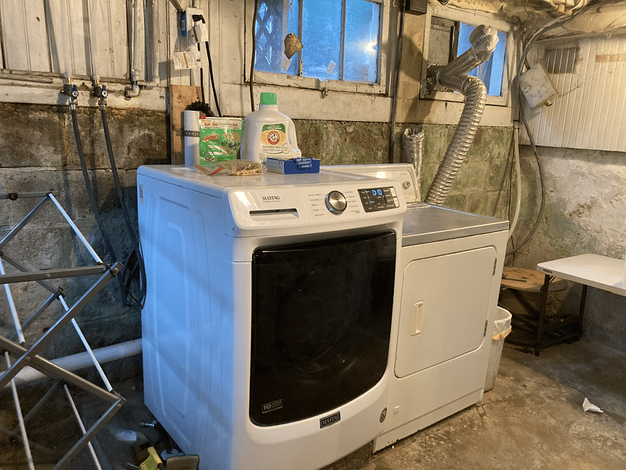 Laundry area in basement of main house, across the parking lot from the garage. 
