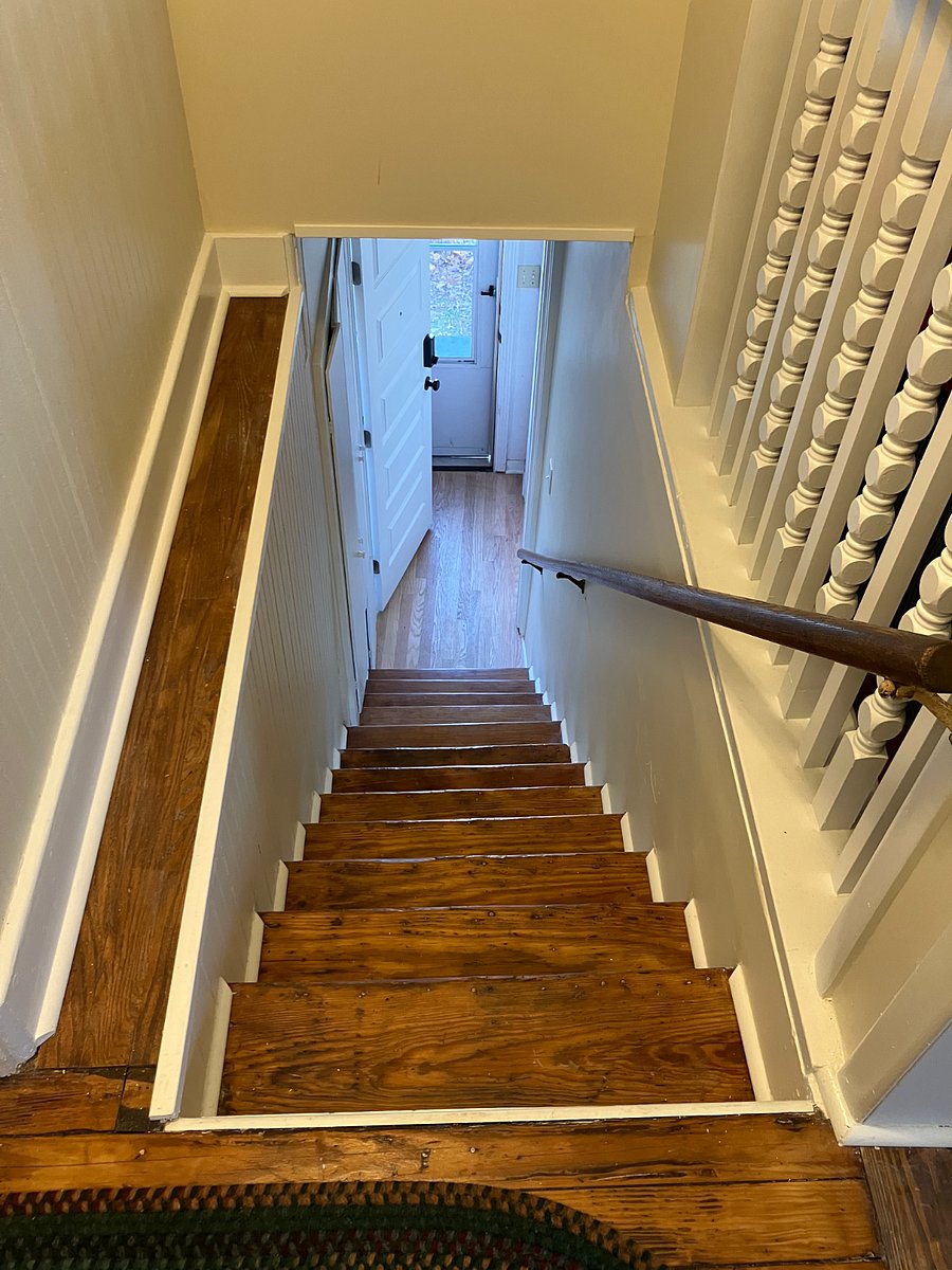 View from apartment down to entryway; 13 steps from entrance to the apartment; not handicapped accessible.