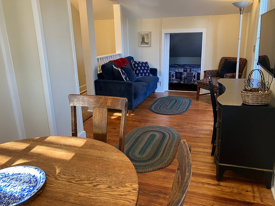 View of dining room/workspace/living room area.