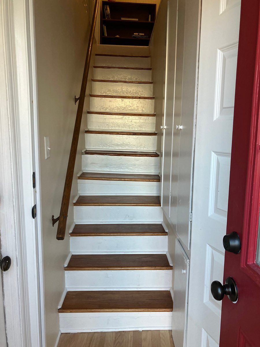 Outer red door opens to small entryway; inner white door opens to 13 stairs that lead up to the apartment. Not handicapped accessible.