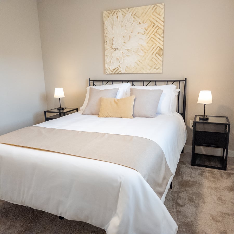 Bedroom #2 Light, airy, and tastefully decorated, balancing style and comfort with whites, beiges, and gold tones.