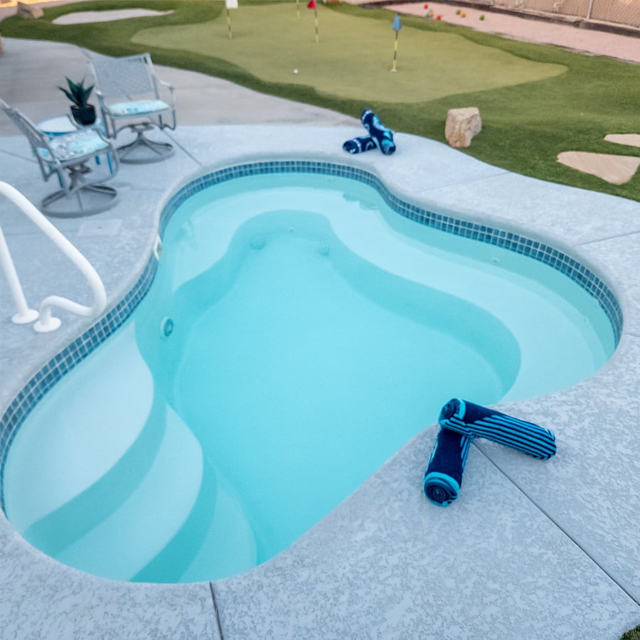 Step outside to your private backyard oasis, complete with a sparkling "cocktail" pool and spaperfect for lounging and socializing. It comfortably seats 10 adults. Enjoy your favorite beverage while you cool off.