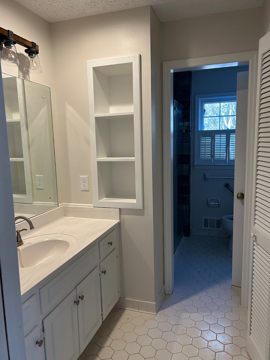 Private Space, Unit #1, (First Floor): Vanity area on left, with storage closet on the right.